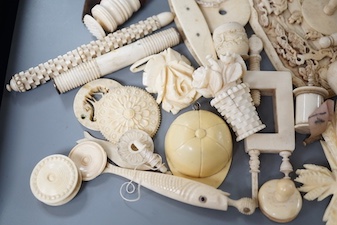 A mixed collection of antique ivory to include a late 18th / early 19th century Chinese carved cartouche, a simulated jockey cap tape measure, etc